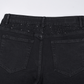 Schmal geschnittene schwarze Jeans mit Strassverzierung