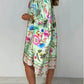 Lockeres Kleid mit V-Ausschnitt und halber Knopfleiste mit Blumenmuster
