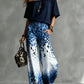 Set aus einem Top mit U-Ausschnitt und schulterfreiem Schnitt sowie einer weiten Hose mit Leopardenmuster und Ombré-Effekt