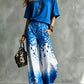 Set aus einem Top mit U-Ausschnitt und schulterfreiem Schnitt sowie einer weiten Hose mit Leopardenmuster und Ombré-Effekt