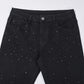 Schmal geschnittene schwarze Jeans mit Strassverzierung