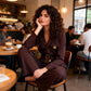 Eleganter Jumpsuit mit Reverskragen, V-Ausschnitt und Gürtel