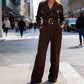 Eleganter Jumpsuit mit Reverskragen, V-Ausschnitt und Gürtel
